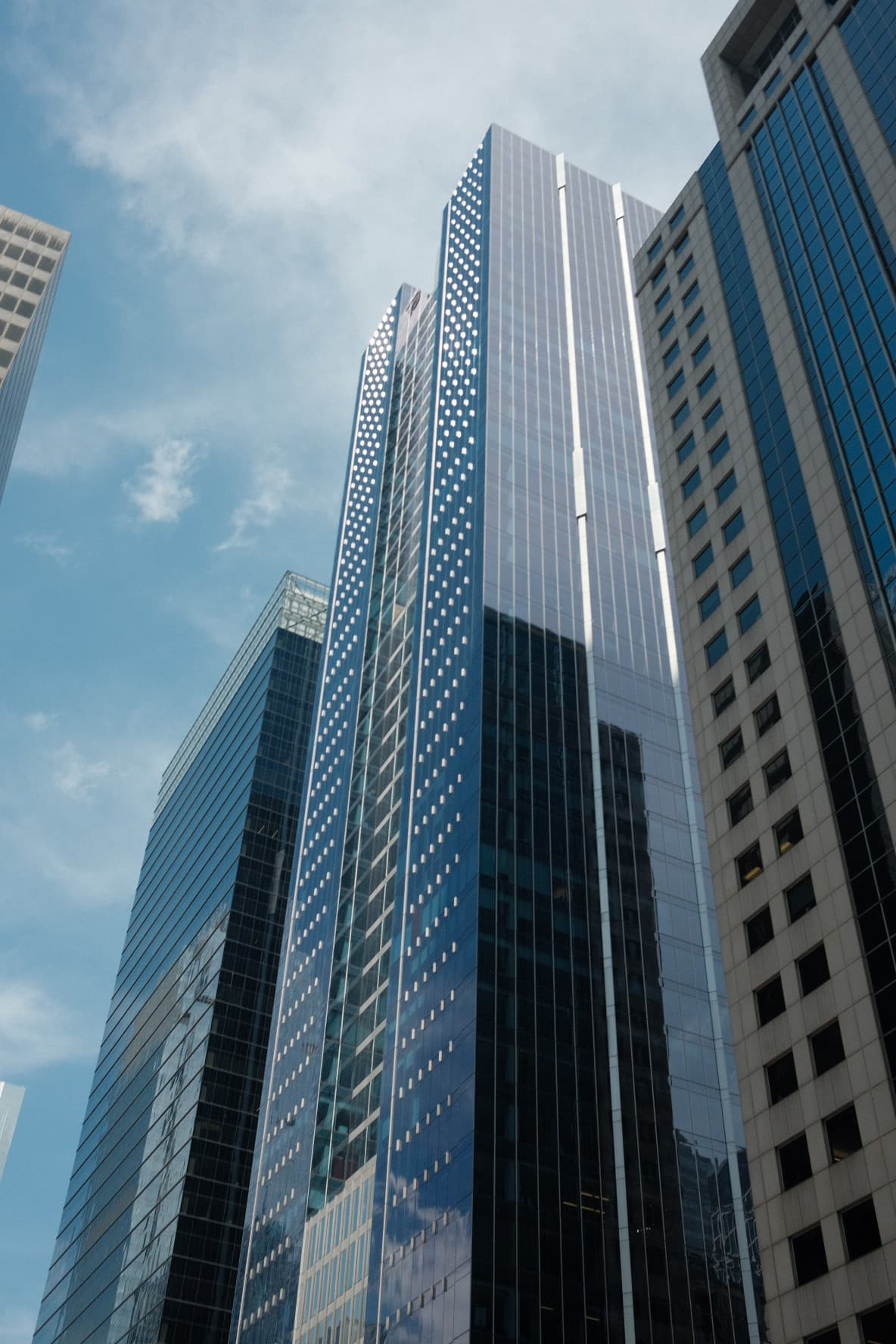 Looking up at glass skyscrapers in downtown Chicago