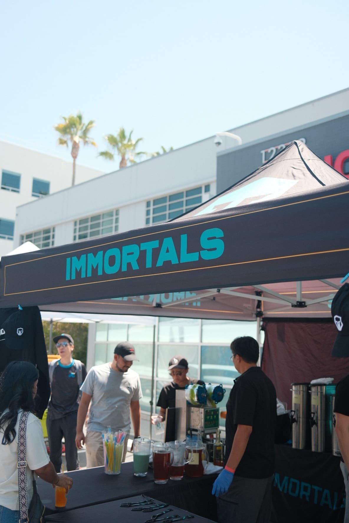 The Immortals tent serving drinks to fans on a sunny day
