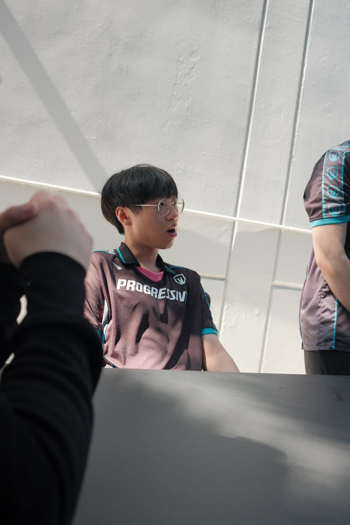 An Immortals player in a Progressive jersey at a fan meet